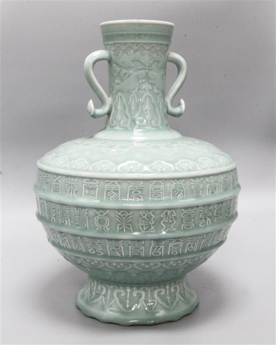 A large Chinese celadon glazed Hundred Shou vase